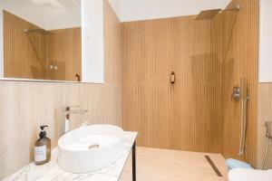a bathroom with a sink and a shower at Riverside Villa in Tragjas +114 photos