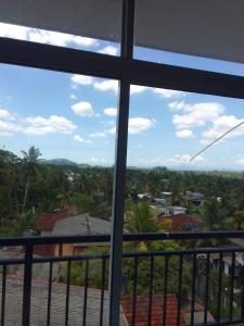 a view of a city from a balcony at Be Cool in Aturugiriya