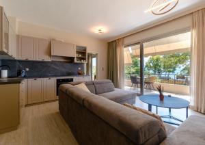 a living room with a couch and a table at Pension Alexandros in Preveza