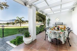 a patio with a table with food on it at Nassau Guest Farm in Stellenbosch
