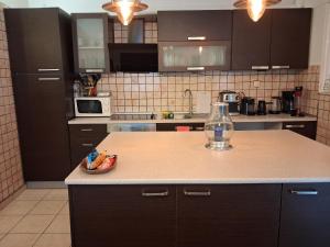 a kitchen with a counter with a vase on it at TAKIS HOUSE in Káto Panayía +16 photos