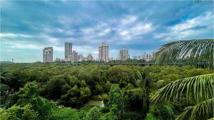 a view of a city with tall buildings in the background at Hotel Suites Inn in Mumbai