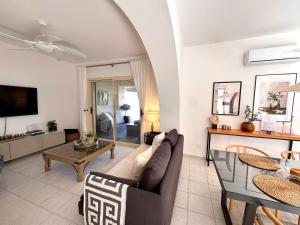 a living room with a couch and a table at Olive Apartment in Tala