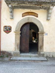 an entrance to a building with a wooden door at Antica Residenza in Perdifumo +16 photos