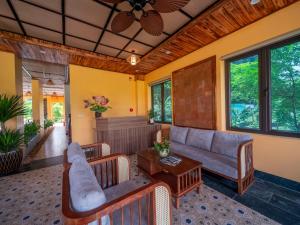 a living room with a couch and a table at Tam Coc Haven House in Ninh Binh +36 photos