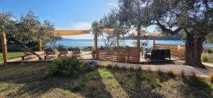 a group of chairs sitting under a gazebo at Actaea Villa in Alonnisos
