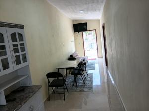 a dining room with a table and chairs at Sucasa Apartment B in Willemstad