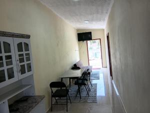 a dining room with a table and chairs at Sucasa Apartment B in Willemstad