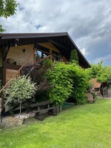 a house with a bunch of bushes on the side of it at Гостинний двір Підкова in Budishche