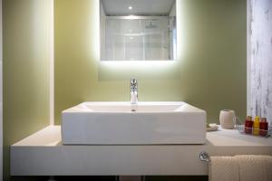 a bathroom with a white sink and a mirror at Agriturismo Tenuta "Il Cigno" in Villanterio +122 photos