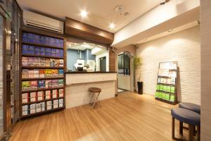 a pharmacy lobby with a counter and a pharmacyacist at HOTEL MYSTAYS Ueno Inaricho in Tokyo