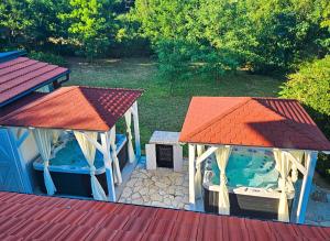 a small house with a small swimming pool and a gazebo at Villa Forko Luxury Spa Near Paradise Beach in Lopar