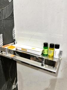 a shelf in a refrigerator with two bottles on it at Agastya Vilas Resort in Dhandni