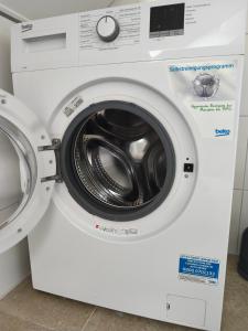 a white dryer with a washing machine next to it at Monteurunterkunft nahe Münster in Drensteinfurt