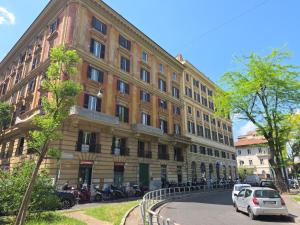 a large building with cars parked in front of it at Liberty House Ten in Rome