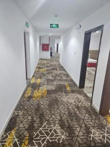 a hallway with graffiti on the floor of a building at فندق الراية الماسية in Mecca