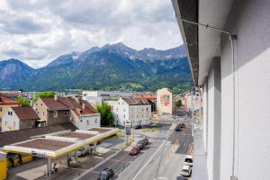 a view of a city with mountains in the background at Noas Bergisel in Innsbruck
