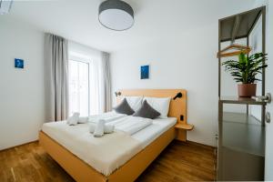 a bedroom with a large bed in a room at Noas Bergisel in Innsbruck