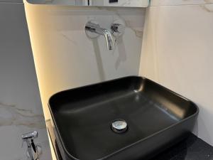 a black sink in a bathroom with a shower at Sorean HOTEL in Ksamil +60 photos