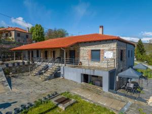 a house is being built with a brick at Vrachos est 1925 in Vráchos
