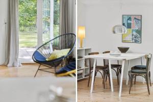 a dining room with a white table and chairs at 1607-Vejby-Laerkebakken-8 in Vejby