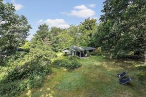 an aerial view of a house in the woods at 1607-Vejby-Laerkebakken-8 in Vejby +24 photos
