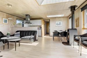 a living room with a couch and a table at SL203-Slagelse-Strandvaenget-46 in Slagelse