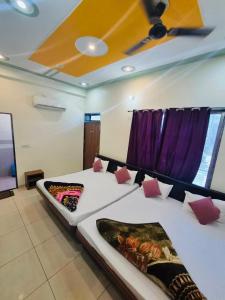 a bedroom with a large bed with a ceiling at Aasha Palace Khatu Shyam Ji in Khātu +38 photos