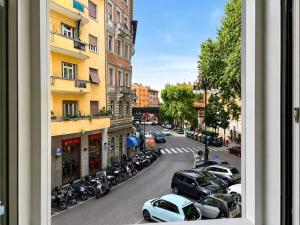 a view from a window of a street with parked cars at Luxury Lodge - Moderno Residence vicino alla Stazione in Trieste