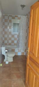 a bathroom with a toilet and a sink and a tub at Bello horizonte in Coín +18 photos