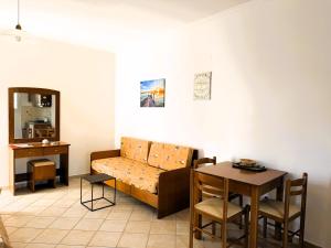a living room with a couch and a table at Celestine Apartment, Arillas, Korfu in Arillas +52 photos