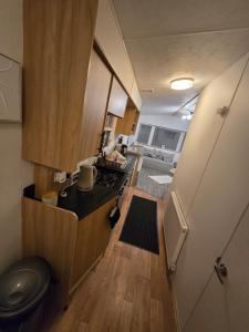 a small kitchen with a sink and a stove at D&D Getaways in Hull +4 photos