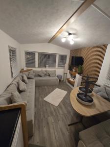 a living room with a couch and a table at D&D Getaways in Hull