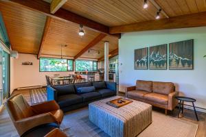 a living room with a couch and a table at Chasing Birdies in Beech Mountain