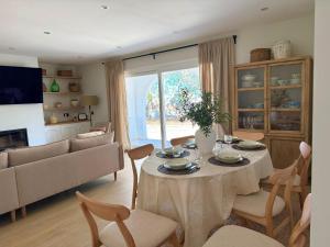 a living room with a table and a couch at El Olivo in Níjar