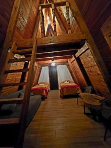 a room with two beds in a attic at Chalet Cuarzo in Mineral del Chico