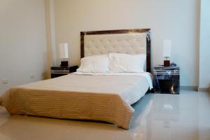 A bed or beds in a room at Casa del Inka Perú