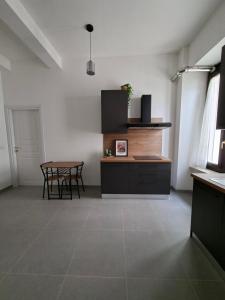 a kitchen with a table and a dining room at Dimora Tre Marie in LʼAquila +18 photos