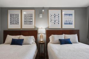 two beds sitting next to each other in a bedroom at Big Spirit Resort in Spirit Lake