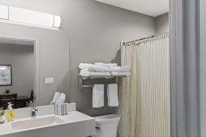 a bathroom with a sink and a toilet and a shower at Big Spirit Resort in Spirit Lake +38 photos
