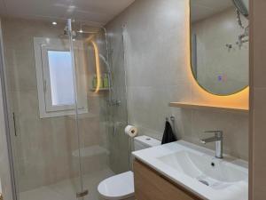 a bathroom with a shower and a sink and a toilet at El Olivo in Níjar +19 photos