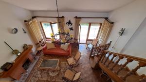 an overhead view of a living room with a red couch at Chalet Pico Frentes in Cidones