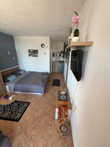 a small room with a bed and a table at Serenity Hill-Bulharsko U Nás in Sveti Vlas