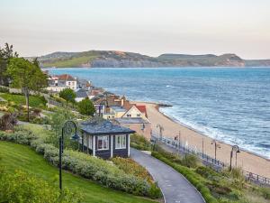 a view of a beach with houses and the ocean at 1 Bed in Axminster oc-82604 in Chardstock