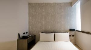 Postelja oz. postelje v sobi nastanitve Wonstar Hotel