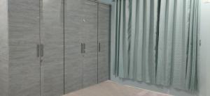 a room with glass cabinets and a window at Orchard Suite in VÄngaon