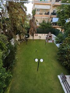 an overhead view of a lawn with two golf balls at Summer Comfort Apartment in Nea Kallikrateia