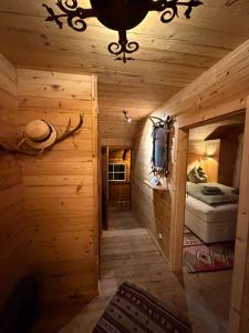 a room with a wooden cabin with a bed at ChaletFeeling im Salzkammergut in Strobl
