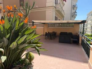 a balcony with a patio with tables and chairs at iPrincipati Luxury Living Suite in Salerno
