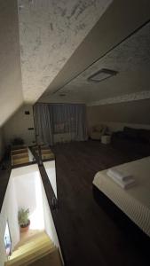 a small room with a bed and a window at Mini House in Shahumyan